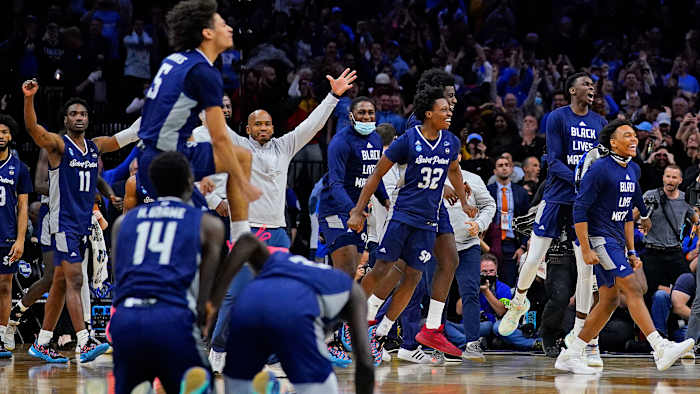 Saint Peter’s celebrates its win over Purdue